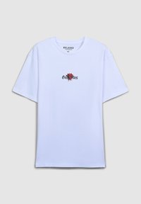 Biała bawełniana koszulka z luźnym krojem, okrągłym dekoltem i centralnym wzorem przedstawiającym czerwoną różę z napisem "Good Vibes" w kolorze czarnym.