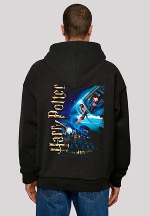 Black hooded sweatshirt featuring a colorful Harry Potter graphic on the back, depicting characters and castle against a night sky.