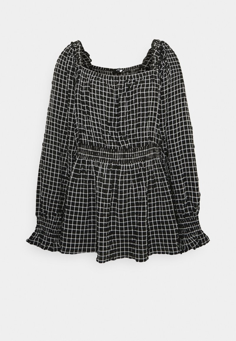 Blouse noire à manches longues avec motif à carreaux blancs, encolure carrée, taille froncée et poignets volantés, présentée sur fond blanc.