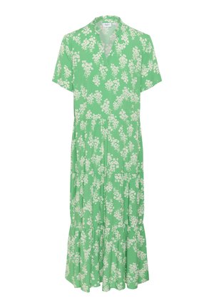 Groene bloemenjurk met korte mouwen, v-hals en gelaagde rok. Witte bloemenpatroon. Gemaakt van lichtgewicht, flexibel materiaal.