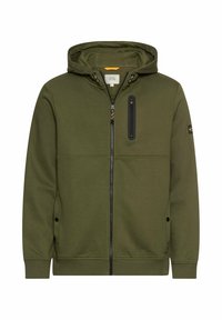 Hoodie zippé vert olive en tissu doux. Comprend une fermeture éclair à l'avant, une poche à la poitrine et des cordons ajustables au niveau de la capuche.