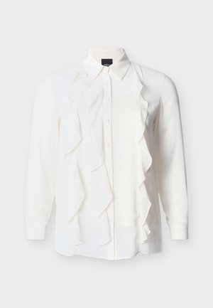 Bluza albă cu mâneci lungi, cu nasturi în față și detalii cu volane căzătoare pe ambele părți ale părții din față.