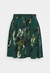 Grüne Rock mit floralem Muster in Schwarz, Weiß und Oliv. Elastischer Bund, leichtes Material und ausgestellte Passform.