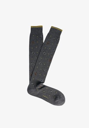 Calzini grigio scuro fino al ginocchio con motivi circolari multicolori e piccoli accenti decorativi. Cima a coste con dettaglio giallo a contrasto.