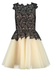 Robe sans manches avec corsage en dentelle florale noire et manches courtes, jupe en tulle beige à plusieurs couches et détails festonnés en dentelle à la taille.