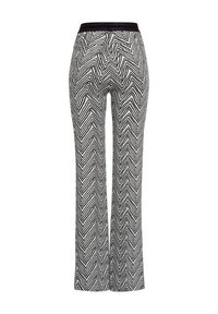 Black and white chevron-patterned wide-leg pants with a stretchy waistband and smooth texture, featuring a high-rise design.