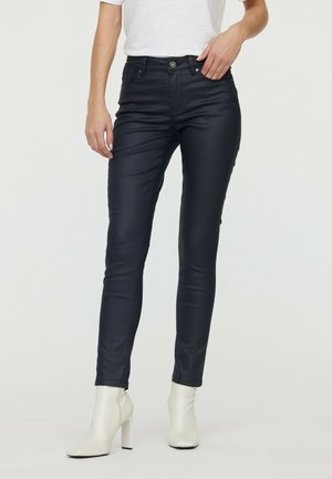 Jean slim bleu foncé en denim, avec cinq poches, fermeture à bouton à l'avant et légère élasticité pour un confort optimal.