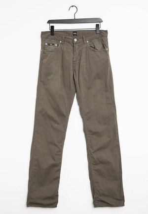 Olive green cotton pants, straight-leg design, featuring two front pockets, a button closure, and contrasting stitching. Hangs from a black hanger.