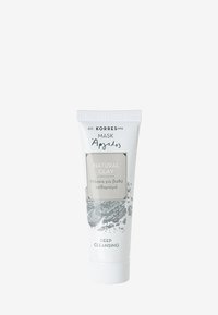 Naturlig lermask i en vit tub med grå accenter. Har en etikett med texten "Naturlig Ler" och "Djup Rengöring" i tydlig typografi.