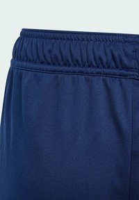 Navy blue athletic shorts with an elastic waistband and smooth texture. Side seam visible, no patterns or additional hardware.