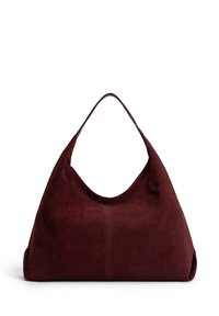 Suede shoulder bag in deep burgundy. Curved silhouette with a single handle and no visible hardware. Soft texture, minimal design.