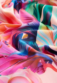 Colorful, silky fabric with swirling patterns in pink, blue, green, and orange tones; smooth texture; vibrant and fluid design.