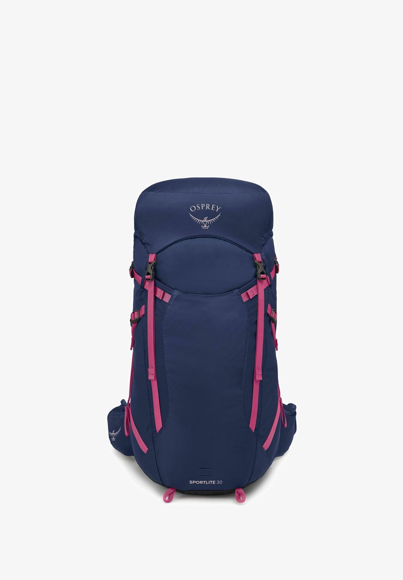 Sac à dos Osprey Sportlite 30 en bleu marine avec des accents roses, doté de bretelles réglables, d'un sommet arrondi et de plusieurs compartiments.