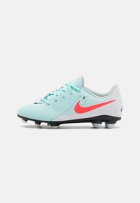 Light blue soccer cleat with a pink swoosh logo, featuring lace closure, textured upper, and black studs for traction.