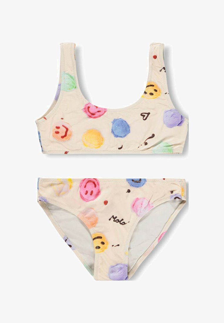 Beige bikini met kleurrijke, handgeschilderde glimlachende gezicht stippen en verspreid over de stof kleine abstracte vormen.