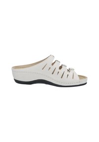 White open-toe clog made of synthetic material, featuring cutout design and black rubber sole. Comfortable, contoured footbed with stitching accents.