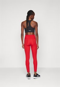 adidas Performance Tekaške pajkice - team power red