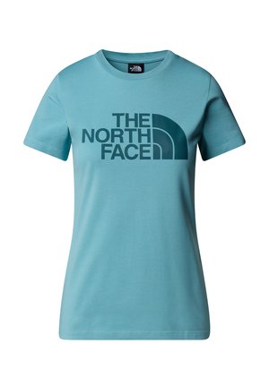 Vaaleansinen t-paita, joka on valmistettu puuvillasta ja jossa on rohkea tummansininen "THE NORTH FACE" -logo rinnassa. Lyhyet hihat ja pyöreä kauluskappa.