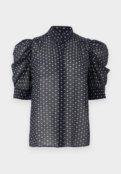 Ναυτικό μπλε διαφανές μπλουζάκι με φουσκωτά κοντά μανίκια και γεωμετ ρικό μοτίβο διαμαντιών, με ψηλό γιακά και κουμπιά μπροστά.