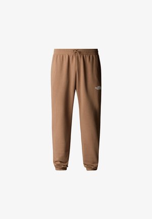 Brune joggerbukser med elastisk talje og manchetter. Blødt stof med et hvidt logo på venstre lår. Simpelt, afslappet design.