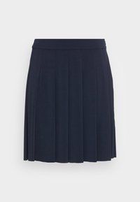 Fållad kjol i mörk marin, tillverkad av mjukt tyg med en slät textur. Har en bred midjeband och faller till knäna.