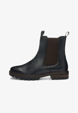 Botte Chelsea en cuir noir avec panneaux latéraux élastiques, languettes de tirage, semelle crantée et petit talon empilé.