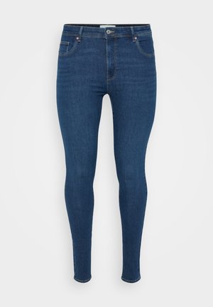 Tmavě modré skinny džínsy vyrobené z denimu, s klasickým designem pěti kapes, plochým předním dílem a kovovým zapínáním v pase.