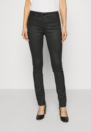 Vaqueros pitillo - coated denim