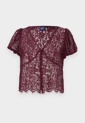 Bordeauxrotes Spitzenoberteil mit kurzen Puffärmeln, V-Ausschnitt und Knopfverschluss. Verziert mit Blumenmustern und einem wellenförmigen Saum.