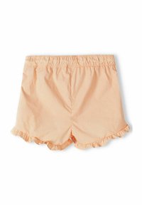 Šortky v broskvové barvě s volánkovým lemem, elastickým pasem a hladkým bavlněným materiálem. Čistý design bez dalších vzorů nebo akcentů.