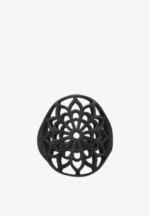 Black circular ring with an open, intricate floral pattern resembling a symmetrical mandala design.