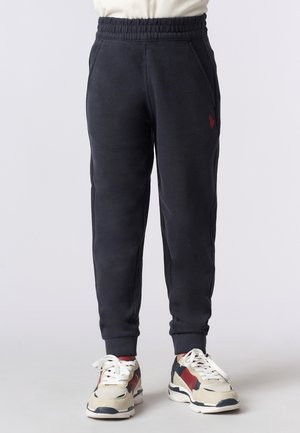 Pantaloni della tuta blu navy con vita elasticizzata, tasche laterali e un piccolo logo rosso. Tessuto morbido e design svasato alla caviglia.