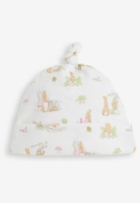 Cappellino in cotone per neonati con punta annodata, caratterizzato da uno sfondo bianco e illustrazioni pastello di conigli, funghi e piante.