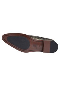 Men's shoe sole with a textured black rubber bottom, brown leather edge, and decorative embossed pattern on upper surface. Size 43 noted.