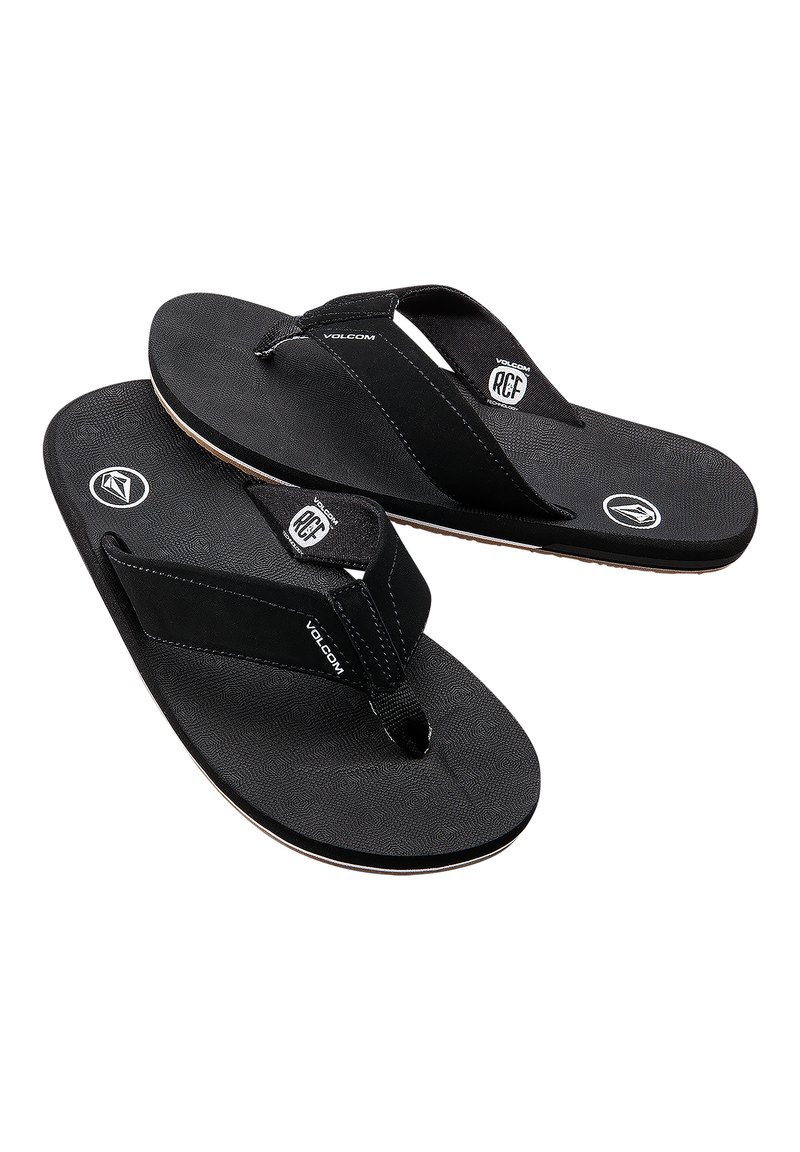 Infradito neri con suole in gomma testurizzata, cinturini in tessuto e dettagli con logo. Design leggero e minimalista, adatto per un look casual.