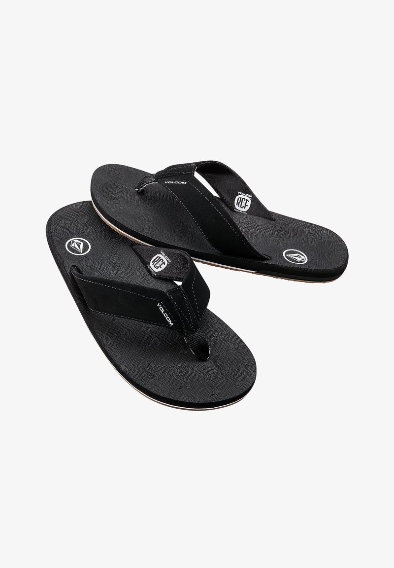 Infradito neri con suole in gomma testurizzata, cinturini in tessuto e dettagli con logo. Design leggero e minimalista, adatto per un look casual.