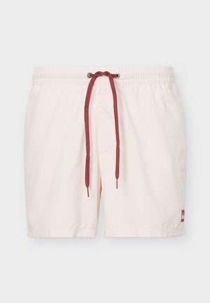 Beežide ujumispüksid elastse vöökohaga ja tumepunase paelaga, vasakul jalal ääre lähedal väike logoplaat.