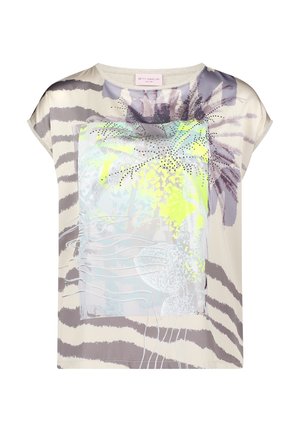 Beżowy top z krótkim rękawem z abstrakcyjnymi paskami zebry, fluorescencyjnym żółtym i fioletowym nadrukiem palmy oraz zdobieniami z kamieniami na przodzie.