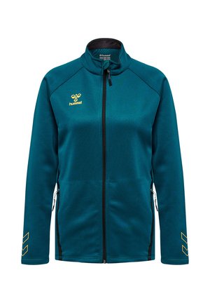 Sportjacke in Türkis mit durchgehendem Reißverschluss und Stehkragen, gelbes hummel-Logo auf der Brust und Chevron-Akzente an den Ärmeln, seitliche Reißverschlusstaschen.