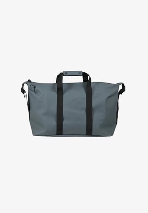 Borsa da viaggio impermeabile grigia con cinturini neri in nylon, tessuto morbido, forma rettangolare e manico con chiusura a scatto. Design minimalista.