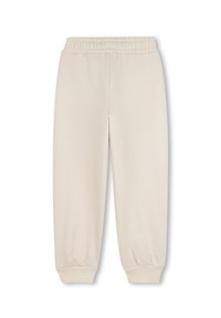 Zweetbroek in een lichtbeige kleur, gemaakt van een zachte stof. Kenmerken zijn een elastische tailleband en ribgebreide boorden, met een losse, taps toelopende pasvorm.