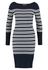 Abito a maglia a coste con scollatura a barca, caratterizzato da righe orizzontali blu navy e bianche. Le maniche lunghe e la forma aderente esaltano la silhouette.