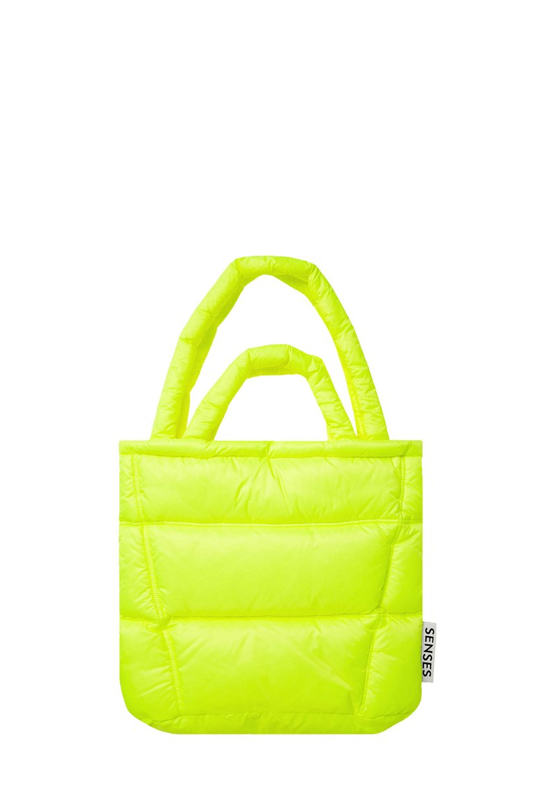 Neon yellow tote bag with a padded design, featuring two handles and a textured surface. Brand label visible on the side.
