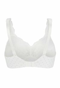 Valkoinen bralette, jossa on kukkakuosi, pitsireunus, läpinäkyvä selkä, säädettävät hihnat ja hakaskiinnitys. Pehmeä kankaan rakenne.
