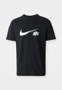 Black cotton T-shirt featuring a large white Nike Swoosh logo and stylized "Nike" text on the front. Short sleeves and crew neck design.