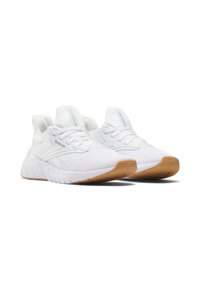 Baskets de sport blanches avec une tige en maille texturée, un col rembourré et une semelle extérieure en caoutchouc. Présente un design léger et des accents du logo Reebok.