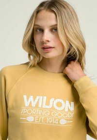 Wilson Felpa - golden