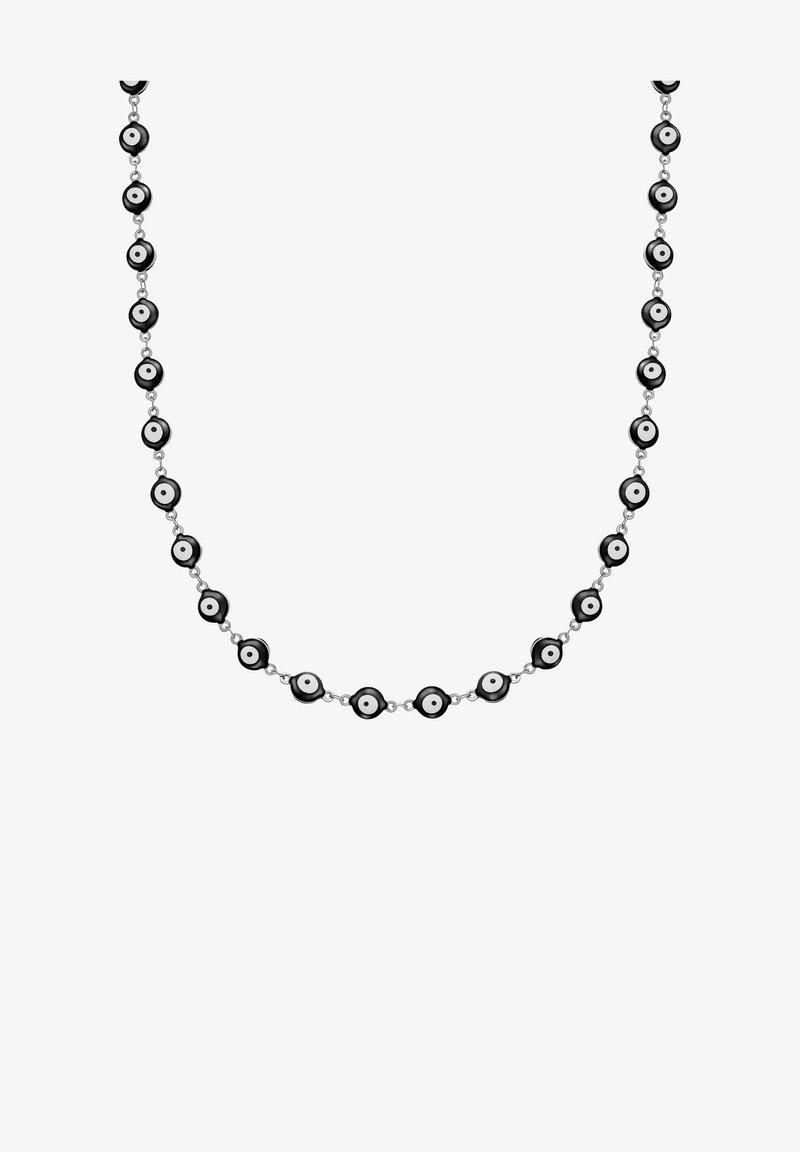 Juodai balta karoliukų apyrankė, kurioje yra apvalūs karoliukai su centriniu baltu tašku, sujungti sidabro spalvos metaline grandinėle.