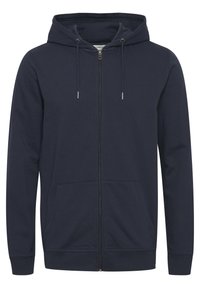 Sweat à capuche zippé bleu marine en coton doux, doté d'une capuche avec cordon de serrage, de poches avant et de poignets et ourlet côtelés. Texture lisse.