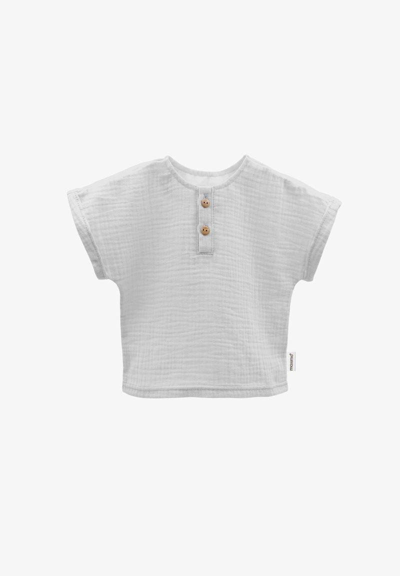 Weißes Baumwolloberteil mit kurzen Ärmeln und strukturiertem Finish, mit Rundhalsausschnitt und zwei Holzknöpfen an der Vorderseite.